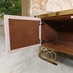 Luxury TV Stand with Textured Upholstered Panels Geometric Stainless Steel Base and Spacious Cabinet Storage